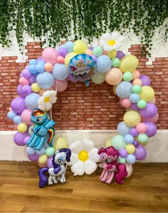 Colourful themed balloon backdrop at a Play Kingdoms birthday party in Kuala Lumpur