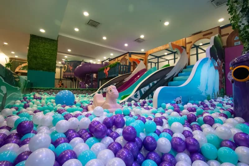Children playing in the soft ball pit at Play Kingdoms indoor playground in Kuala Lumpur