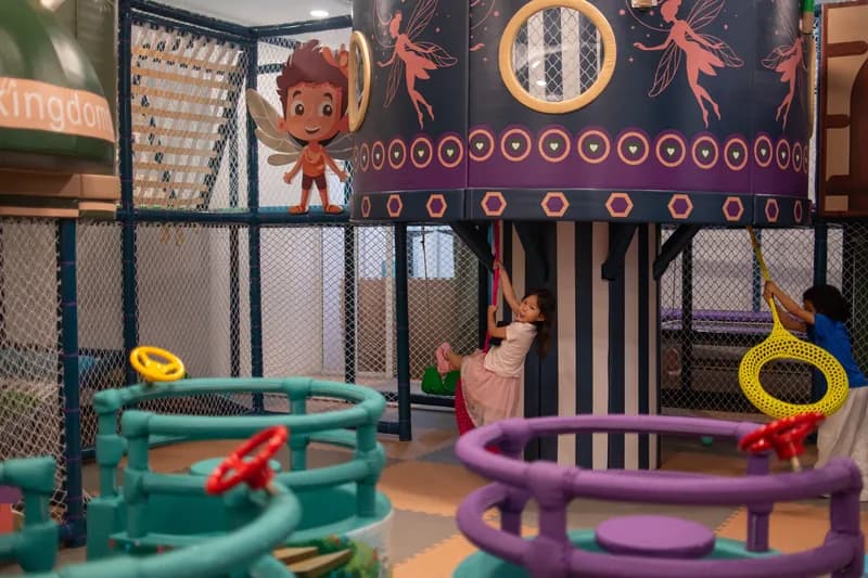 Kids having fun on the swings at Play Kingdoms indoor playground